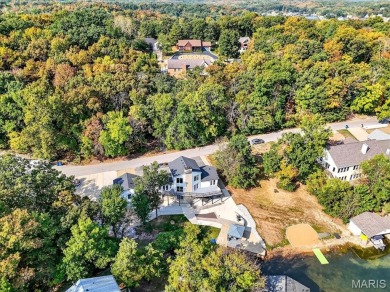 Beautiful 1.5-story waterfront home in the gated lake & golf on Raintree Country Club in Missouri - for sale on GolfHomes.com, golf home, golf lot