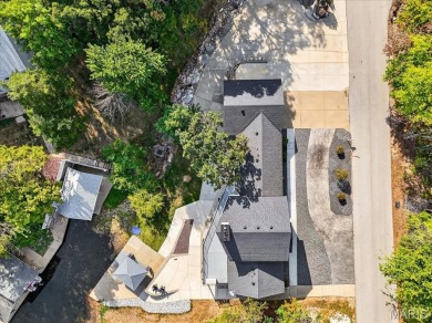 Beautiful 1.5-story waterfront home in the gated lake & golf on Raintree Country Club in Missouri - for sale on GolfHomes.com, golf home, golf lot