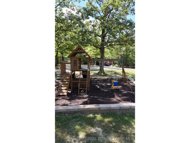 Location! Location! Located in the highly desirable Tan Tar A on The Oaks Golf Course in Missouri - for sale on GolfHomes.com, golf home, golf lot