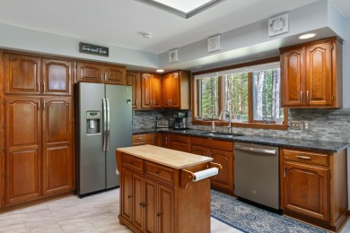 Beautifully crafted 3 bed, 2 full and 2 half bath home in the on Indian River Golf Club in Michigan - for sale on GolfHomes.com, golf home, golf lot