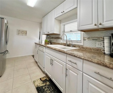 This 2 bedroom, 2 bathroom residence boasts numerous upgrades on Fairway Village Golf Course in Florida - for sale on GolfHomes.com, golf home, golf lot