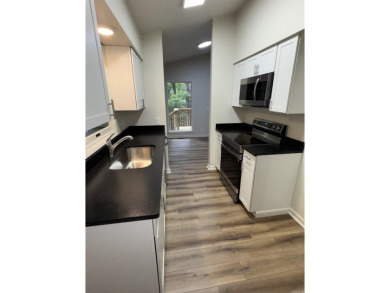 UPDATED: 2 bed 2 bath plus office. New roof, flooring, cabinets on Cortez Golf Course in Arkansas - for sale on GolfHomes.com, golf home, golf lot