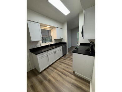 UPDATED: 2 bed 2 bath plus office. New roof, flooring, cabinets on Cortez Golf Course in Arkansas - for sale on GolfHomes.com, golf home, golf lot