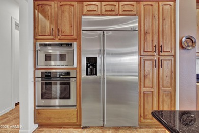 Exquisitely sited, this DISTINCTIVELY BEAUTIFUL LAKE FRONT GOLF on Trilogy Golf Club At Vistancia in Arizona - for sale on GolfHomes.com, golf home, golf lot