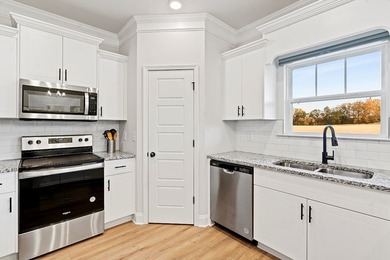 Welcome to effortless living in this inviting open-concept home on The Links At Stoney Point in South Carolina - for sale on GolfHomes.com, golf home, golf lot