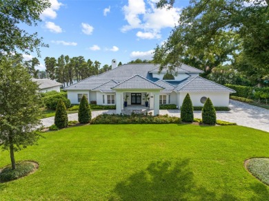 Breathtaking lake and golf views abound from this majestic on Isleworth Golf and Country Club in Florida - for sale on GolfHomes.com, golf home, golf lot