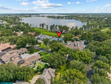 Breathtaking lake and golf views abound from this majestic on Isleworth Golf and Country Club in Florida - for sale on GolfHomes.com, golf home, golf lot