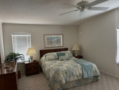 LIVING room is very spacious with bay windows, carpet flooring on Silver Dollar Golf and Trap Club in Florida - for sale on GolfHomes.com, golf home, golf lot