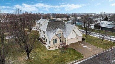 Welcome to this inviting 4-bedroom, 5-bathroom home located on River Oaks Golf Club in Minnesota - for sale on GolfHomes.com, golf home, golf lot