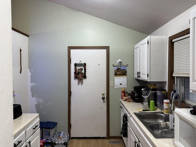 Discover the potential in this 3 bed, 2 bath ranch home on Lakes of the Four Seasons Country Club in Indiana - for sale on GolfHomes.com, golf home, golf lot