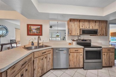 This immaculate and well-maintained home truly offers everything on Jacaranda West Country Club in Florida - for sale on GolfHomes.com, golf home, golf lot