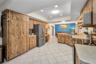 This immaculate and well-maintained home truly offers everything on Jacaranda West Country Club in Florida - for sale on GolfHomes.com, golf home, golf lot