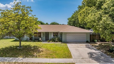 Welcome to this beautifully maintained 3-bedroom, 2-bathroom on Oak Hills Country Club in Florida - for sale on GolfHomes.com, golf home, golf lot