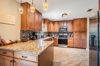 Welcome to this beautifully maintained 3-bedroom, 2-bathroom on Oak Hills Country Club in Florida - for sale on GolfHomes.com, golf home, golf lot