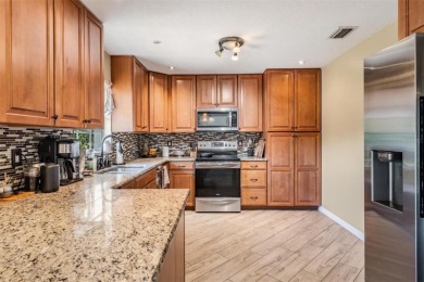 Welcome to this beautifully maintained 3-bedroom, 2-bathroom on Oak Hills Country Club in Florida - for sale on GolfHomes.com, golf home, golf lot
