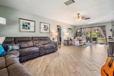 Welcome to this beautifully maintained 3-bedroom, 2-bathroom on Oak Hills Country Club in Florida - for sale on GolfHomes.com, golf home, golf lot