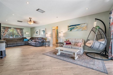 Welcome to this beautifully maintained 3-bedroom, 2-bathroom on Oak Hills Country Club in Florida - for sale on GolfHomes.com, golf home, golf lot