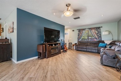 Welcome to this beautifully maintained 3-bedroom, 2-bathroom on Oak Hills Country Club in Florida - for sale on GolfHomes.com, golf home, golf lot