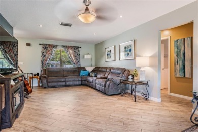 Welcome to this beautifully maintained 3-bedroom, 2-bathroom on Oak Hills Country Club in Florida - for sale on GolfHomes.com, golf home, golf lot