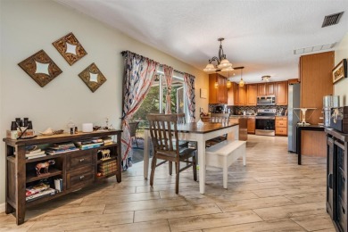 Welcome to this beautifully maintained 3-bedroom, 2-bathroom on Oak Hills Country Club in Florida - for sale on GolfHomes.com, golf home, golf lot