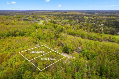 Escape to the beauty of Michaywe with this .74-acre wooded on Mountain Lake Golf Club in Michigan - for sale on GolfHomes.com, golf home, golf lot
