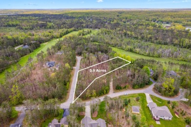 Escape to the beauty of Michaywe with this .9-acre wooded lot on Michaywe Pines Course in Michigan - for sale on GolfHomes.com, golf home, golf lot
