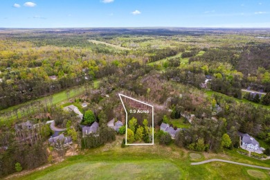 Escape to the beauty of Michaywe with this .9-acre wooded lot on Michaywe Pines Course in Michigan - for sale on GolfHomes.com, golf home, golf lot