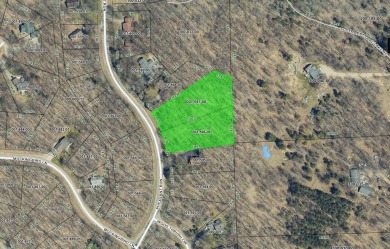 Escape to the beauty of Michaywe with this 1.87-acre wooded on Michaywe Pines Course in Michigan - for sale on GolfHomes.com, golf home, golf lot