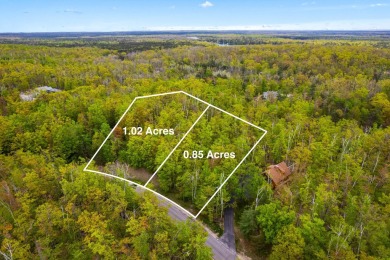 Escape to the beauty of Michaywe with this 1.87-acre wooded on Michaywe Pines Course in Michigan - for sale on GolfHomes.com, golf home, golf lot