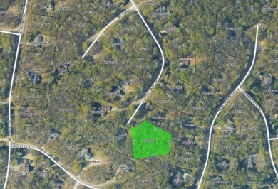 Escape to the beauty of Michaywe with this .78-acre wooded lot on Michaywe Pines Course in Michigan - for sale on GolfHomes.com, golf home, golf lot
