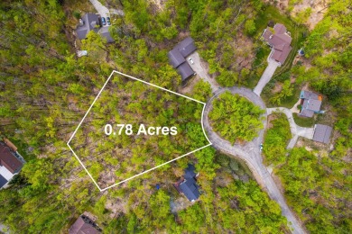 Escape to the beauty of Michaywe with this .78-acre wooded lot on Michaywe Pines Course in Michigan - for sale on GolfHomes.com, golf home, golf lot