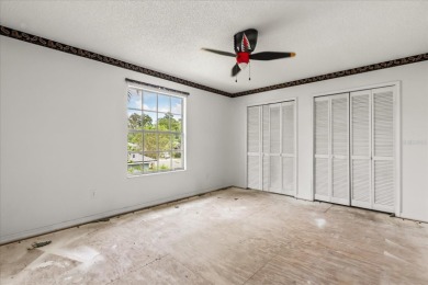 **SELLER IS PREPARED TO REPLACE THE ROOF PRIOR TO CLOSING** on Eastwood Golf Club in Florida - for sale on GolfHomes.com, golf home, golf lot