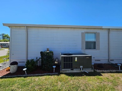 This home is in a 55+ resort-style manufactured home community on Big Cypress Golf and Country Club in Florida - for sale on GolfHomes.com, golf home, golf lot