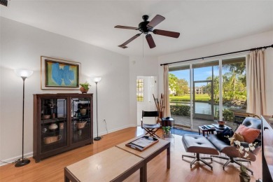 Maintenance-Free Luxury Living with Waterfall Views in on Grasslands Golf and Country Club in Florida - for sale on GolfHomes.com, golf home, golf lot