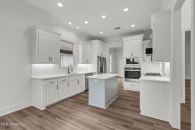 **FULLY REMODELED, BRAND NEW ROOF, GERMANTOWN SCHOOL ZONE, ON on Lake Caroline Golf Club in Mississippi - for sale on GolfHomes.com, golf home, golf lot