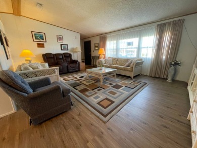 Swiss Golf & Tennis 55+ Community - 2 Bedroom, 2 Bath Home - on Lake Henry Golf Club in Florida - for sale on GolfHomes.com, golf home, golf lot