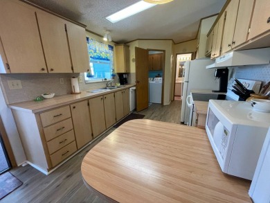 Swiss Golf & Tennis 55+ Community - 2 Bedroom, 2 Bath Home - on Lake Henry Golf Club in Florida - for sale on GolfHomes.com, golf home, golf lot