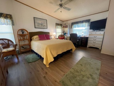 Swiss Golf & Tennis 55+ Community - 2 Bedroom, 2 Bath Home - on Lake Henry Golf Club in Florida - for sale on GolfHomes.com, golf home, golf lot