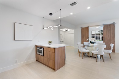 This light-filled first-floor condo has been completely on Polo Club of Boca Raton in Florida - for sale on GolfHomes.com, golf home, golf lot