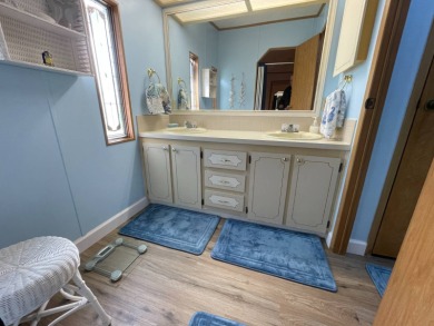 Down 5K! Swiss Golf & Tennis 55+ Community -Charming, mostly on Lake Henry Golf Club in Florida - for sale on GolfHomes.com, golf home, golf lot