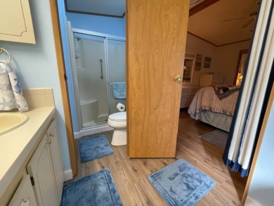 Down 5K! Swiss Golf & Tennis 55+ Community -Charming, mostly on Lake Henry Golf Club in Florida - for sale on GolfHomes.com, golf home, golf lot