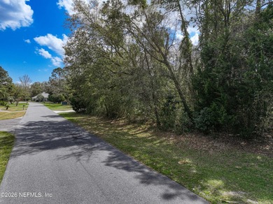 This beautiful lot is nestled in the gated community of Magnolia on Magnolia Point Golf and Country Club in Florida - for sale on GolfHomes.com, golf home, golf lot