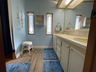 Down 5K! Swiss Golf & Tennis 55+ Community -Charming, mostly on Lake Henry Golf Club in Florida - for sale on GolfHomes.com, golf home, golf lot