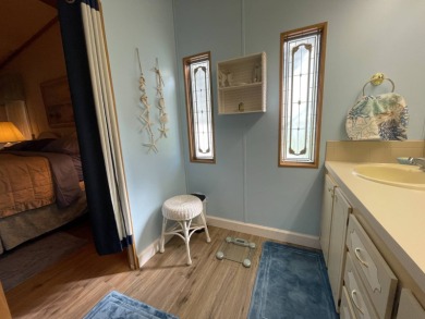 Down 5K! Swiss Golf & Tennis 55+ Community -Charming, mostly on Lake Henry Golf Club in Florida - for sale on GolfHomes.com, golf home, golf lot