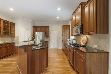 Located in the sought-after Windermere community of Cumming on Windermere Golf Club in Georgia - for sale on GolfHomes.com, golf home, golf lot