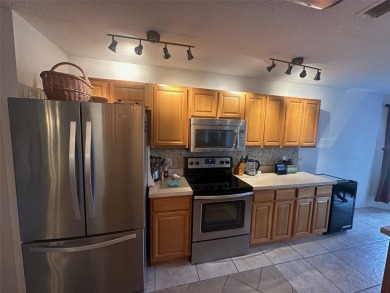 Charming 2 Bedroom + Study, 2 Bath Home in Premier 55+ Gated on On Top of the World Golf Course in Florida - for sale on GolfHomes.com, golf home, golf lot