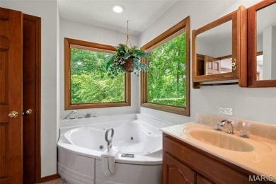 Tucked among the trees this spacious 4-bedroom retreat offers on Innsbrook Resort Golf Course in Missouri - for sale on GolfHomes.com, golf home, golf lot