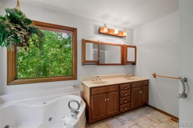 Tucked among the trees this spacious 4-bedroom retreat offers on Innsbrook Resort Golf Course in Missouri - for sale on GolfHomes.com, golf home, golf lot