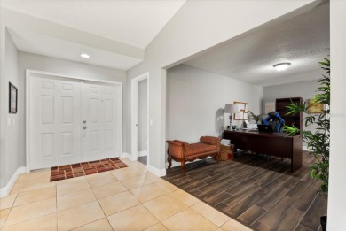 Welcome to this beautifully remodeled 5-bedroom, 3-bath home on Orange Tree Golf Club in Florida - for sale on GolfHomes.com, golf home, golf lot