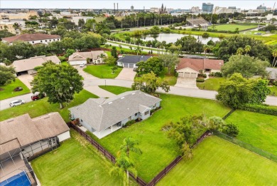 Welcome to this beautifully remodeled 5-bedroom, 3-bath home on Orange Tree Golf Club in Florida - for sale on GolfHomes.com, golf home, golf lot